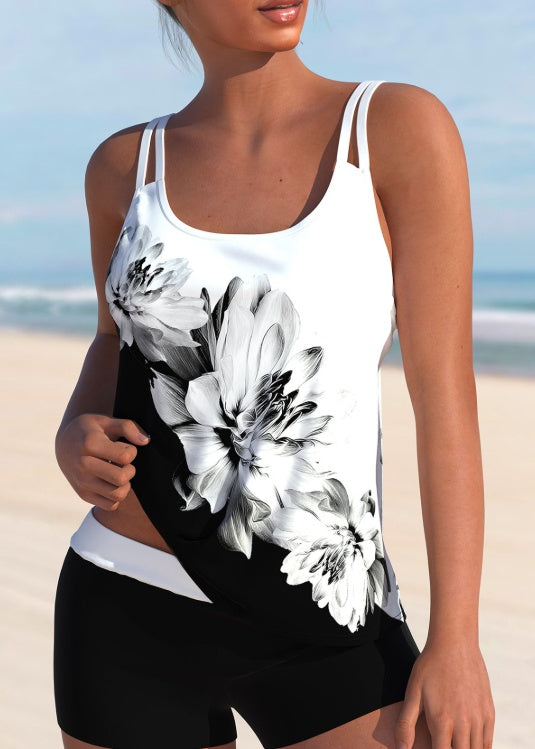 Ladies' floral printed fashionable camisole vest with black and white floral design, featuring double shoulder straps. Perfect for beach outings and casual wear.